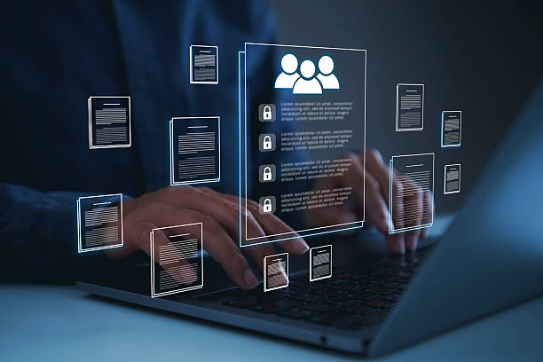 Human resources data management system businessman using laptop virtual employee profile interface to organize corporate documents secure records access control and digital workforce administration.